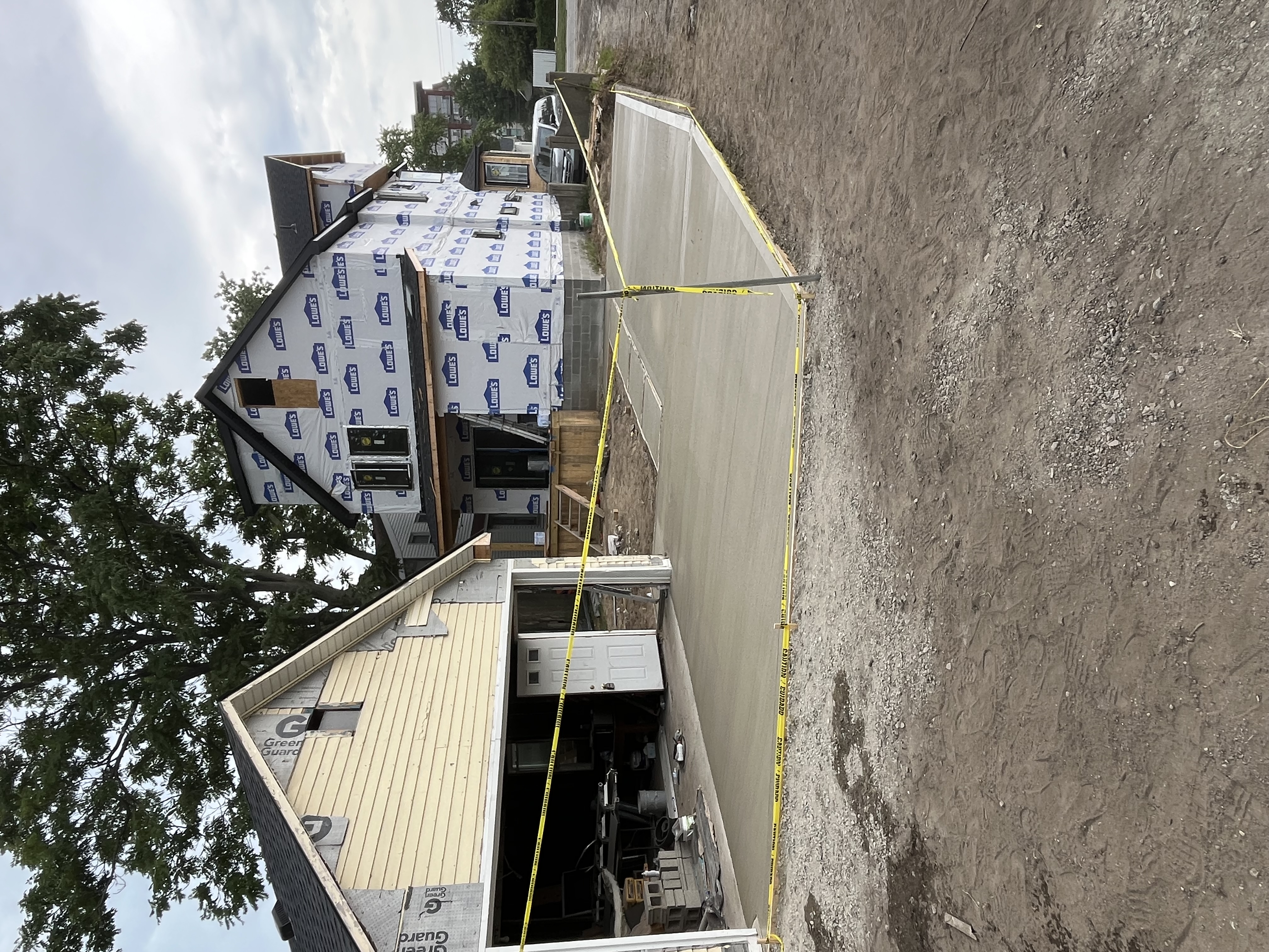 Fresh concrete driveway pour at new construction