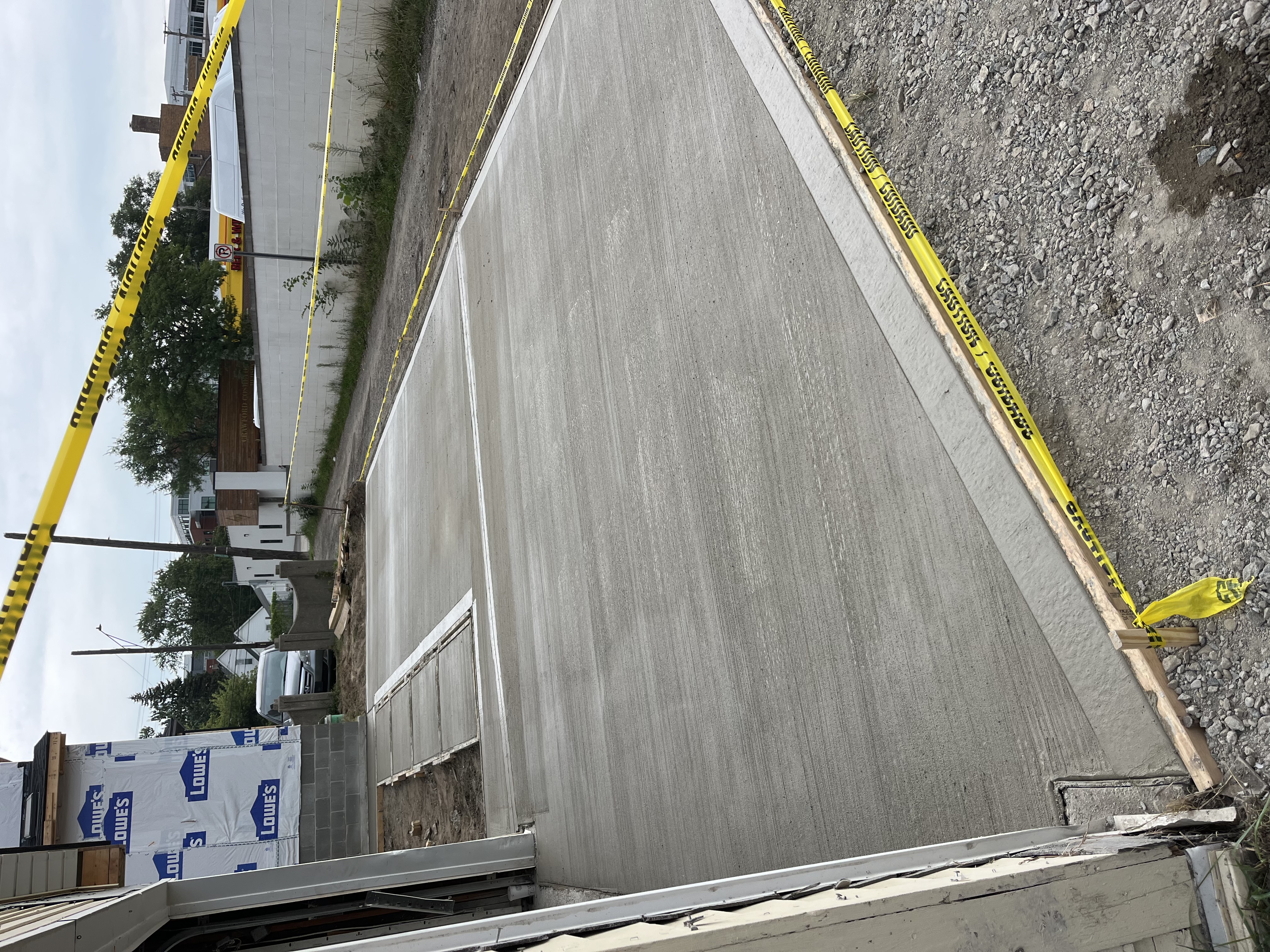 Broom-finished concrete driveway installation