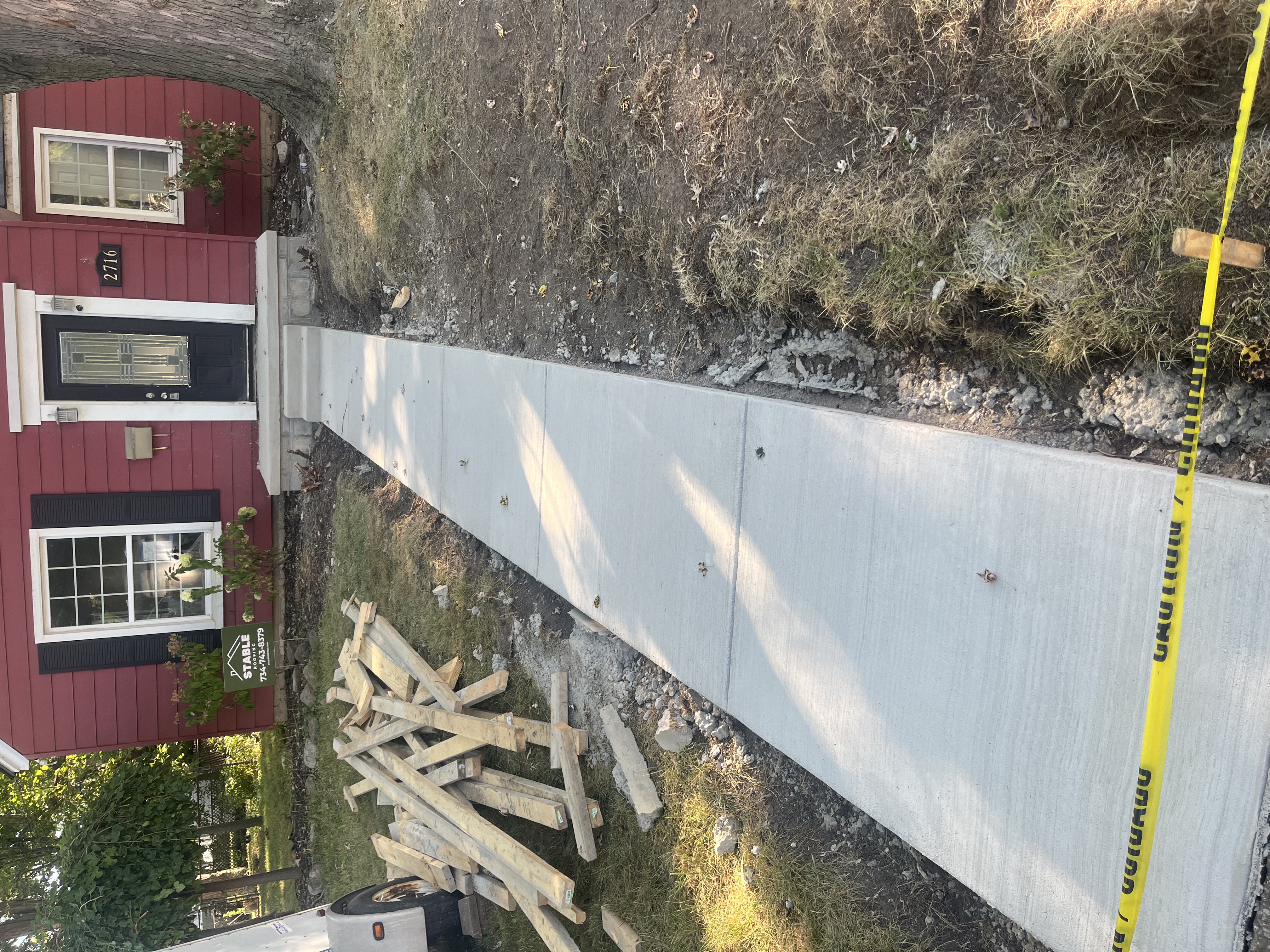Concrete sidewalk and walkway to front entry