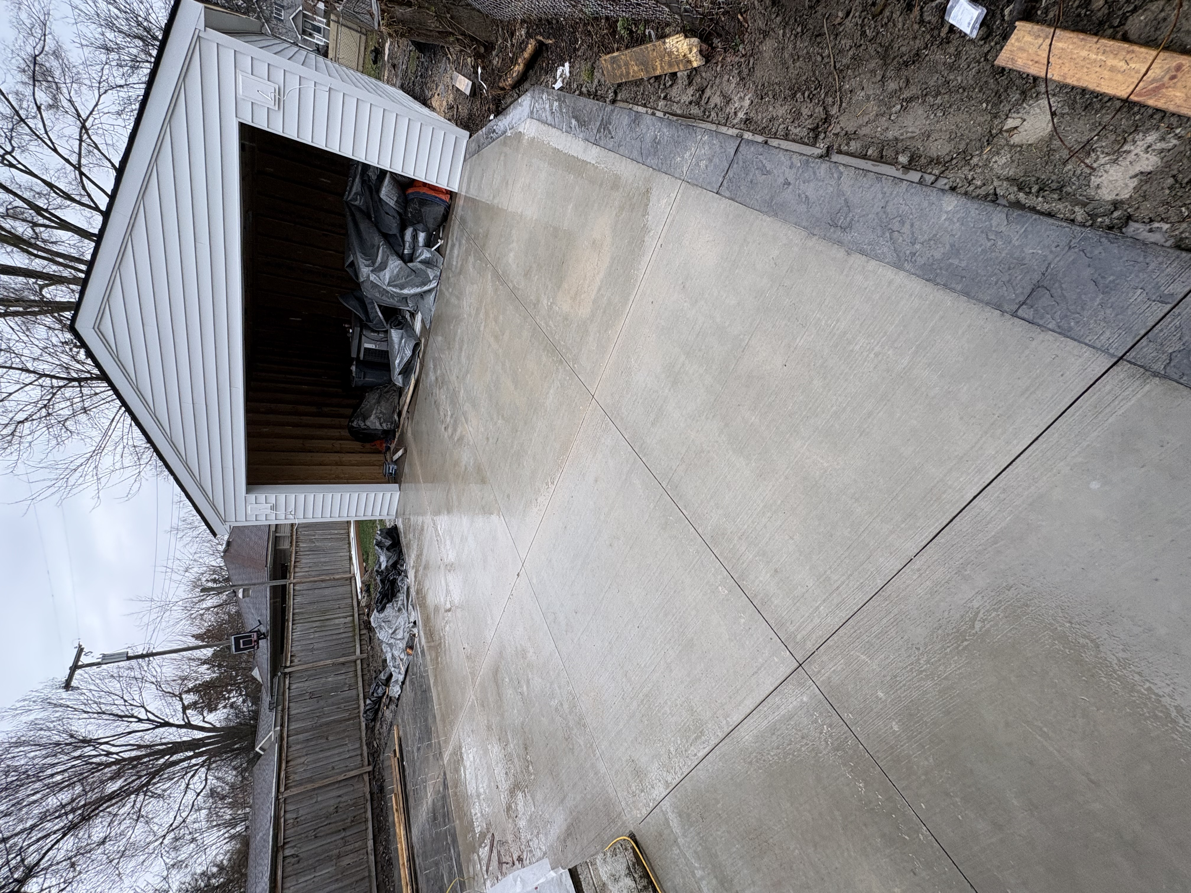 Finished concrete driveway with clean joints at residential home