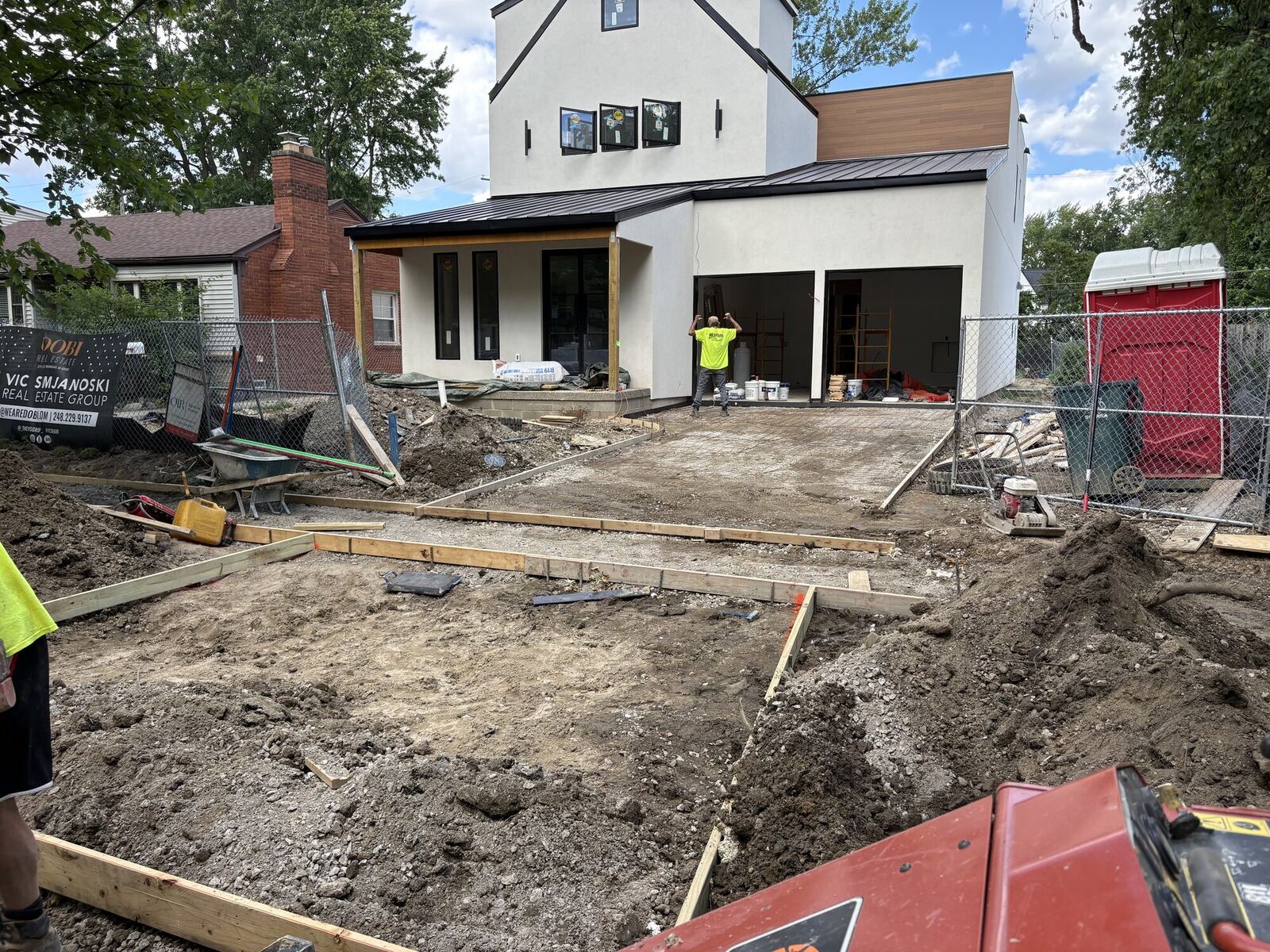 Driveway and walkway forms set and graded before the pour at a modern new home
