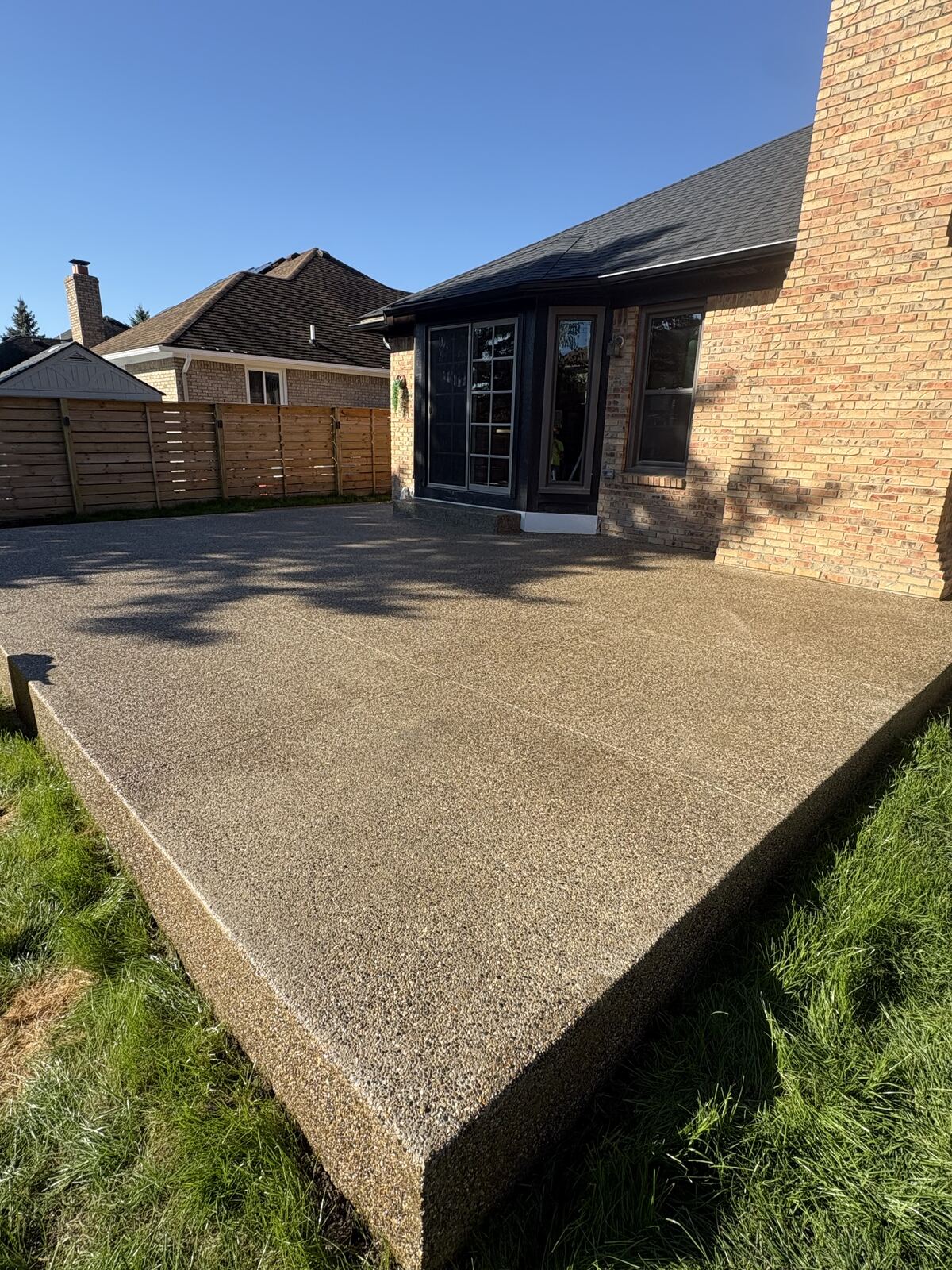 Close-up of exposed aggregate patio edge and finish